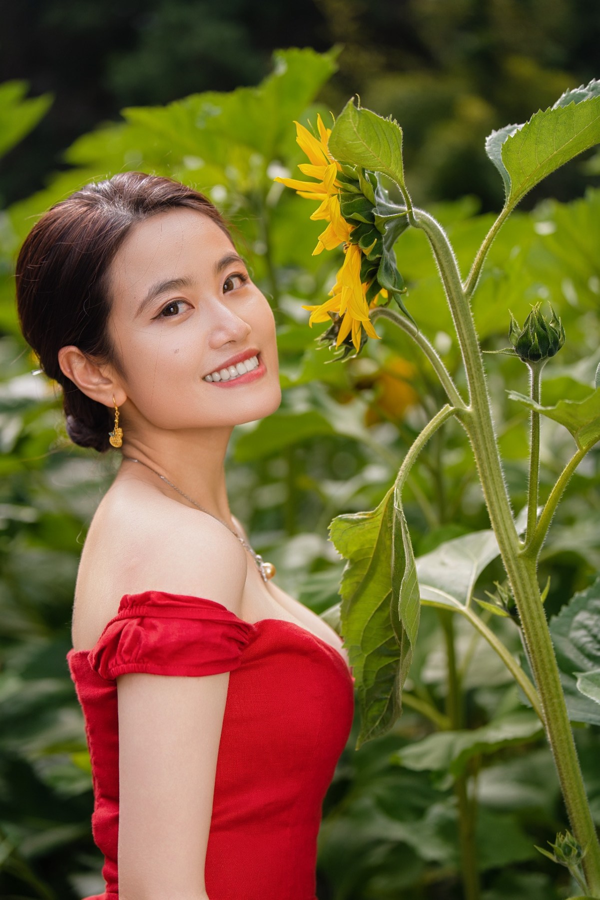 Mary smiling among sunflowers